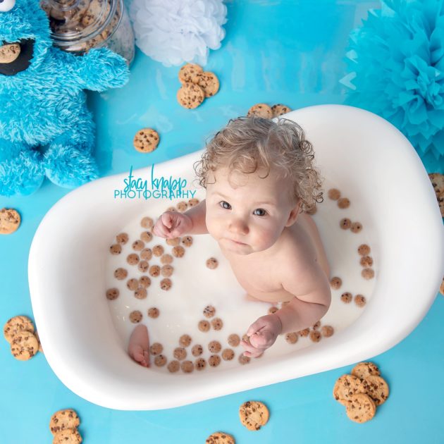 Baby girl in cookie monster bath during a splash session