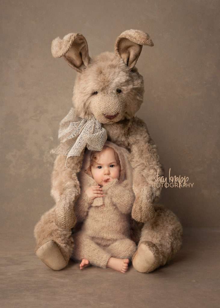 Easter photo of a baby girl in a bunny costume