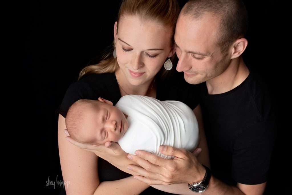 Newborn baby boy with parents newborn portrait
