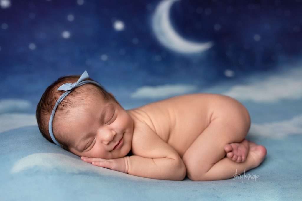 Maine newborn baby girl on moon backdrop by photographer Stacy Knapp Photography