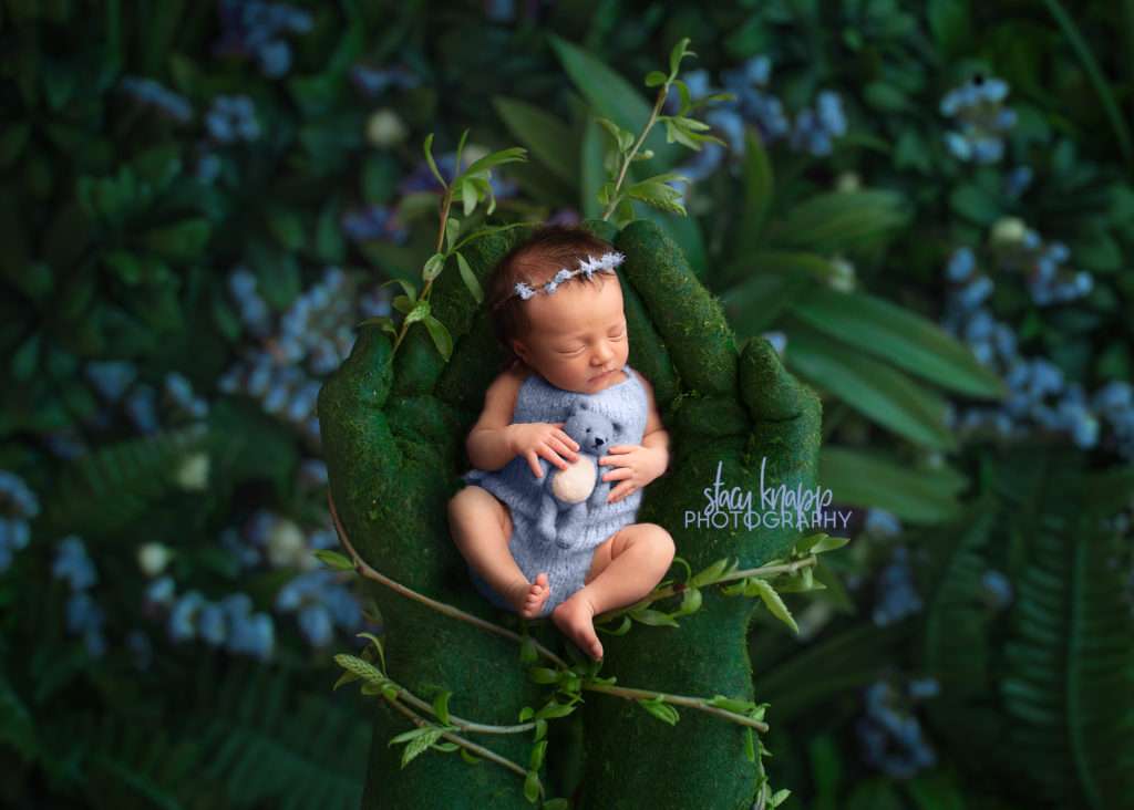 photo of newborn baby girl in mother earths hands