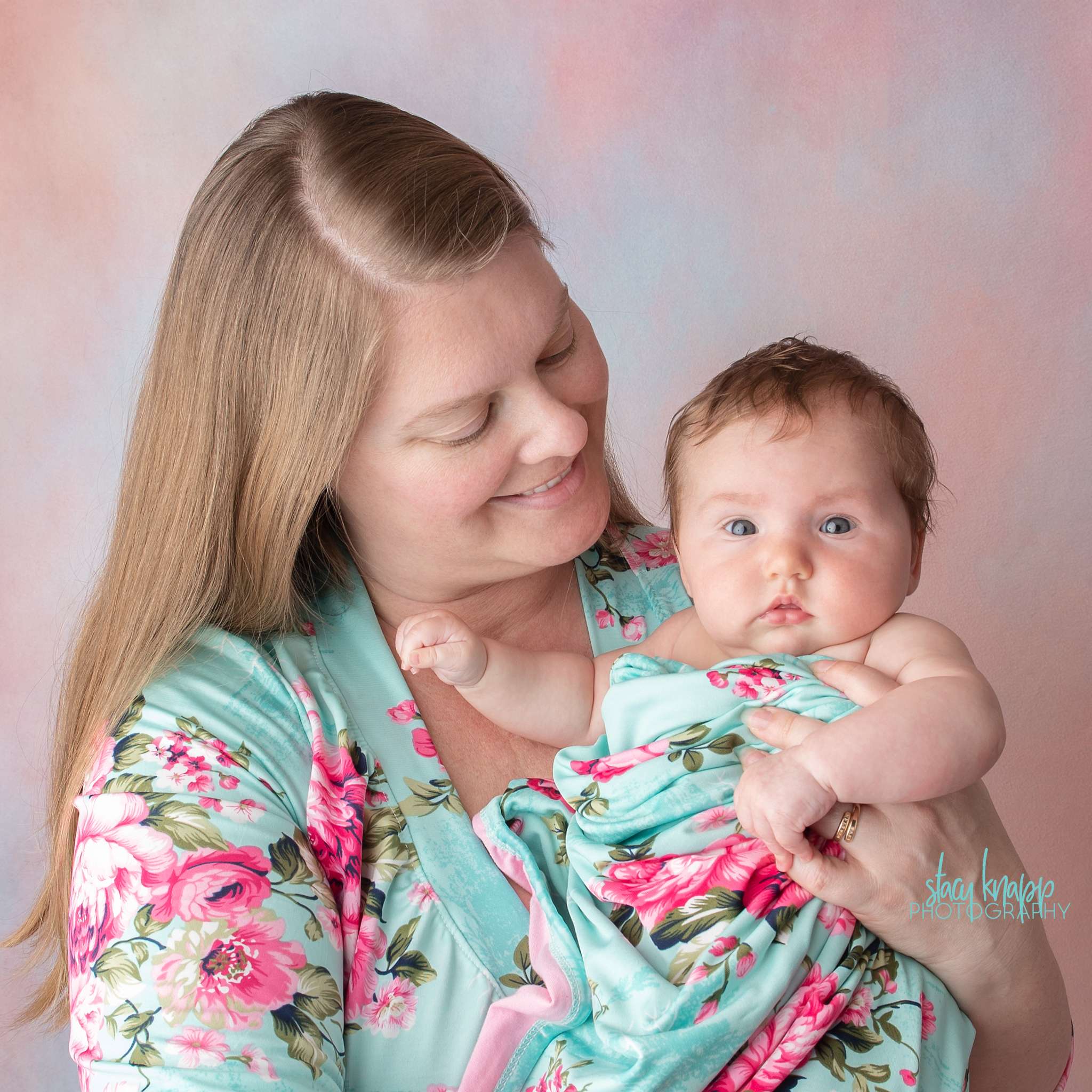 Mommy and me photo session with baby girl on pink backdrop