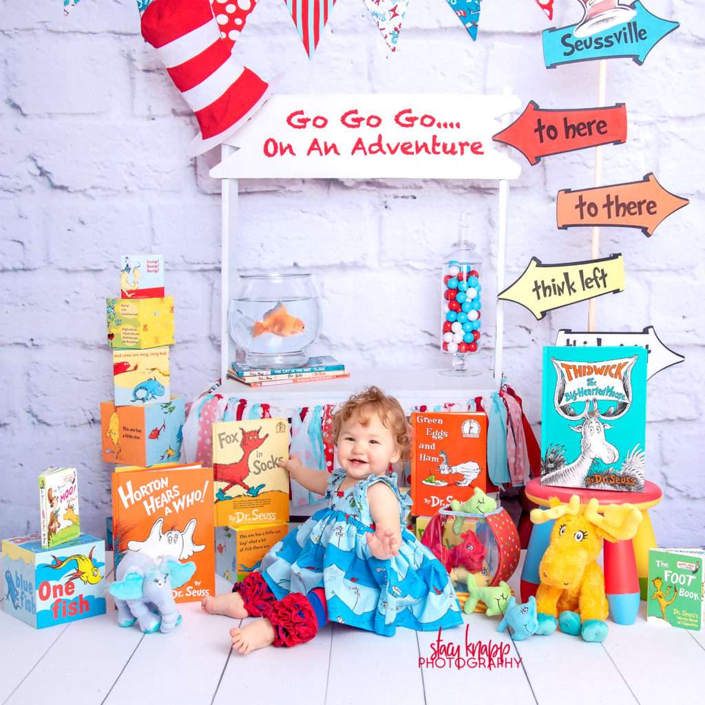 Baby girl photographed on Dr Seuss backdrop