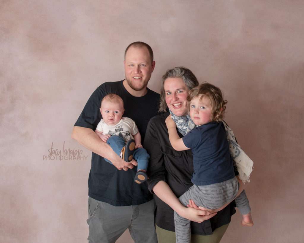 Family photo on light brown backdrop