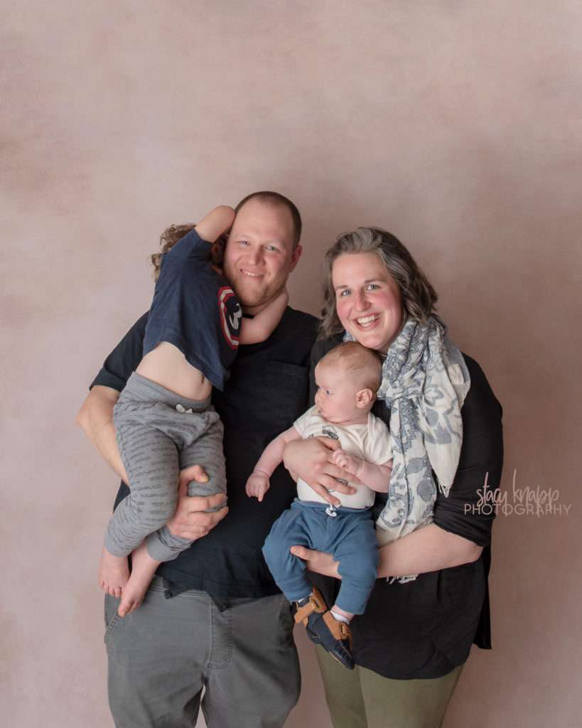 Family photo on light brown backdrop