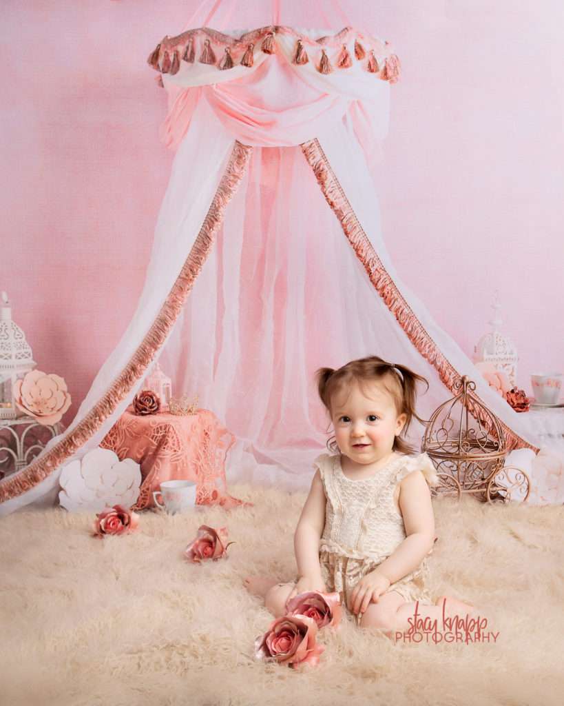 Photo of toddler girl session with pink tent