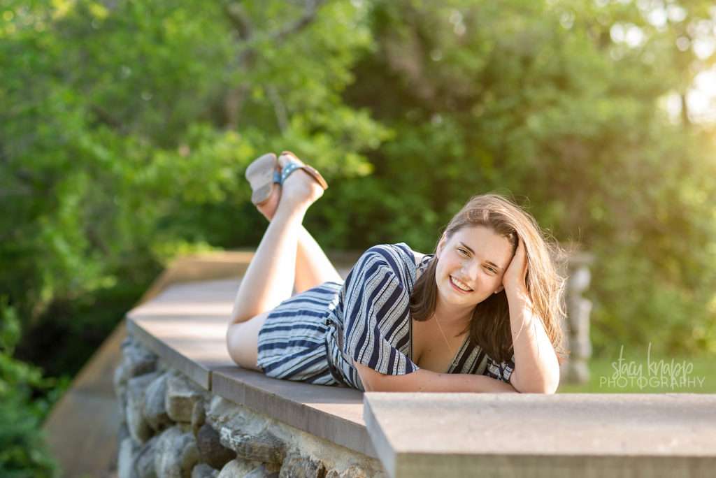 Senior girl photo on rock wall in Augusta, Maine