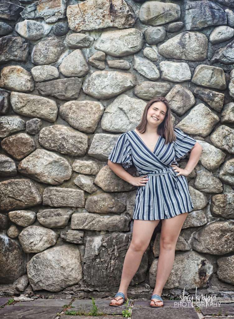 Senior girl photo on rock wall in Augusta, Maine