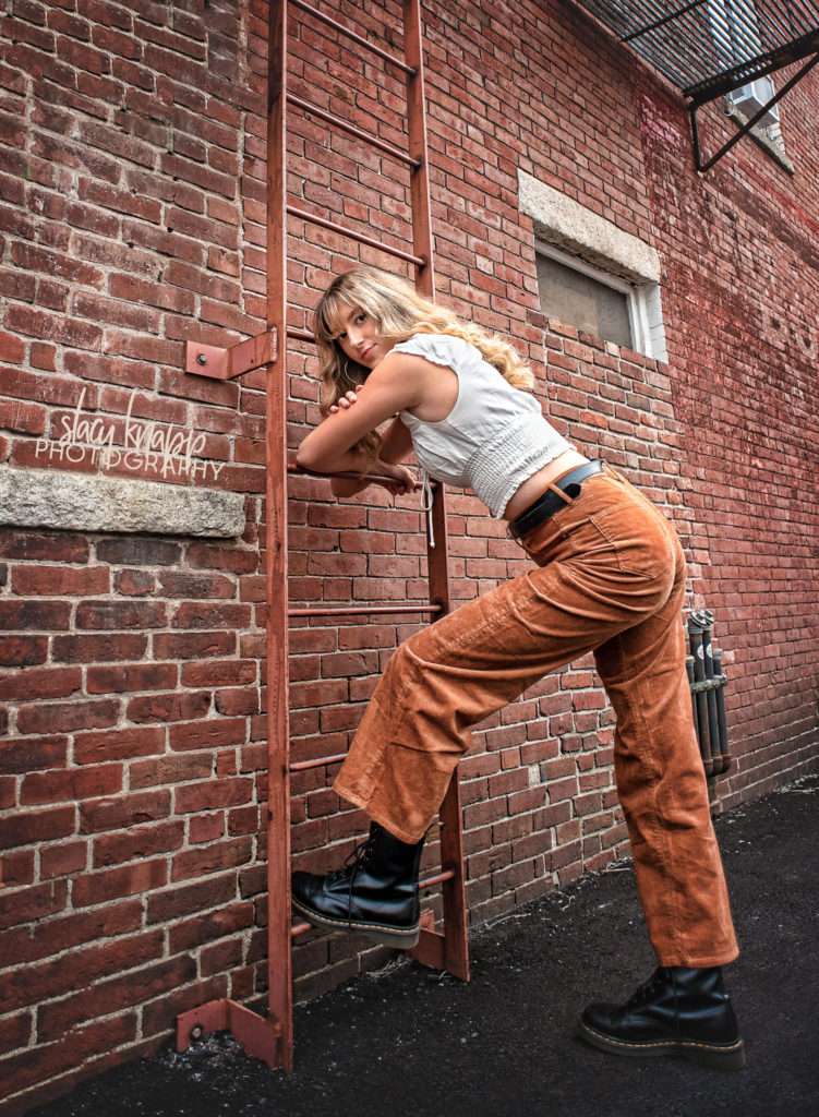 Senior girl by ladder