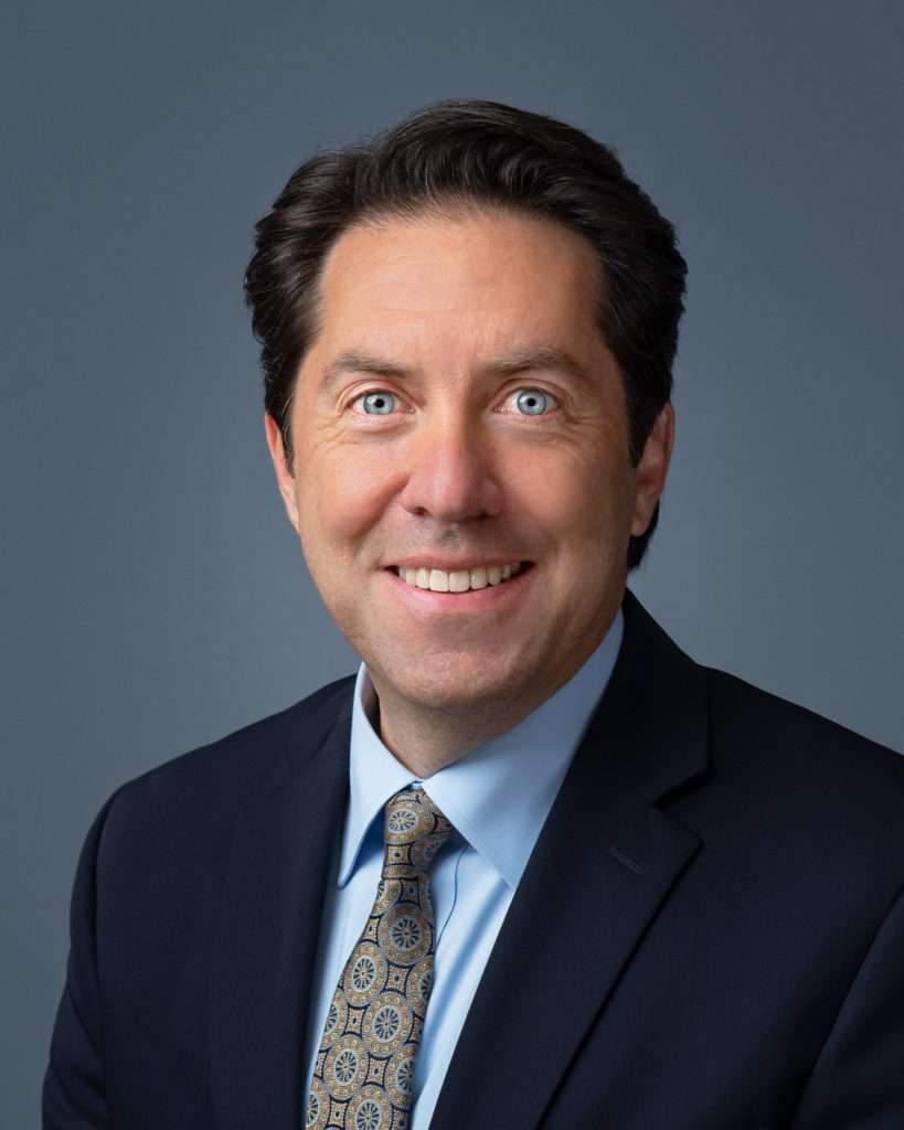 Man in navy suit headshot by photographer Stacy Knapp Photography