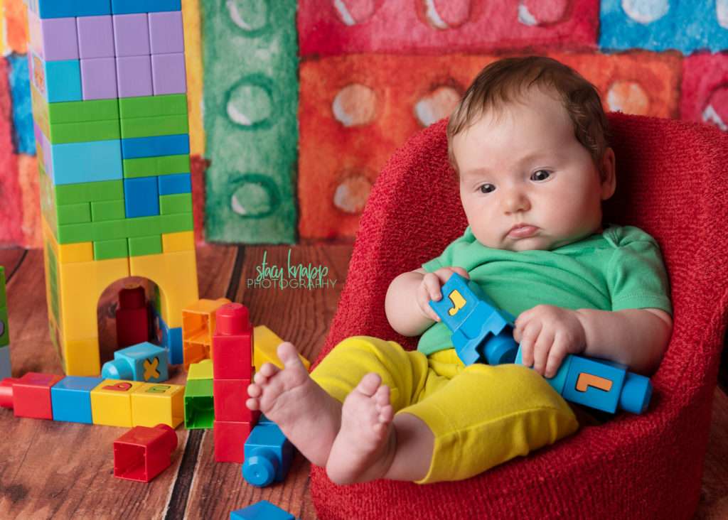Baby girl on lego backdrop
