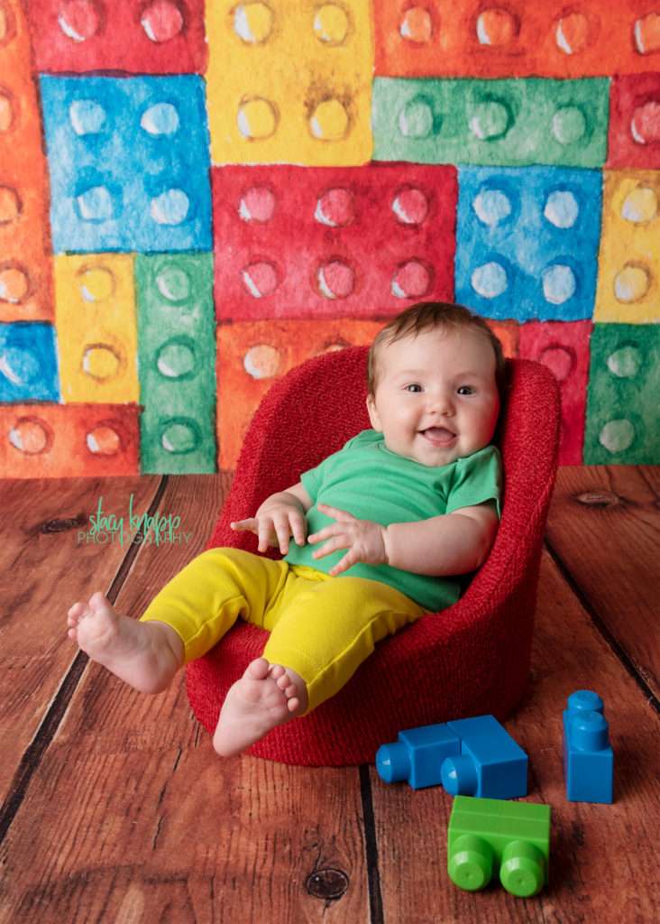 Baby girl on lego backdrop