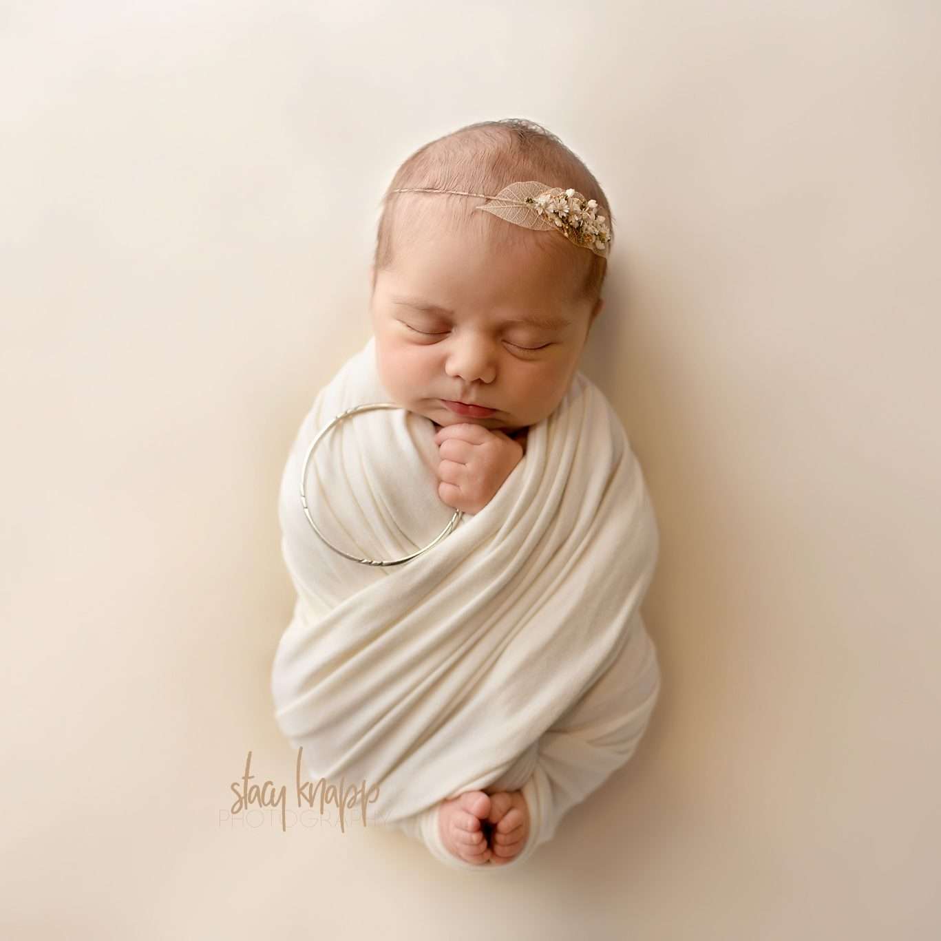 Maine newborn baby girl holding her grandmothers bracelet by photographer Stacy Knapp Photography