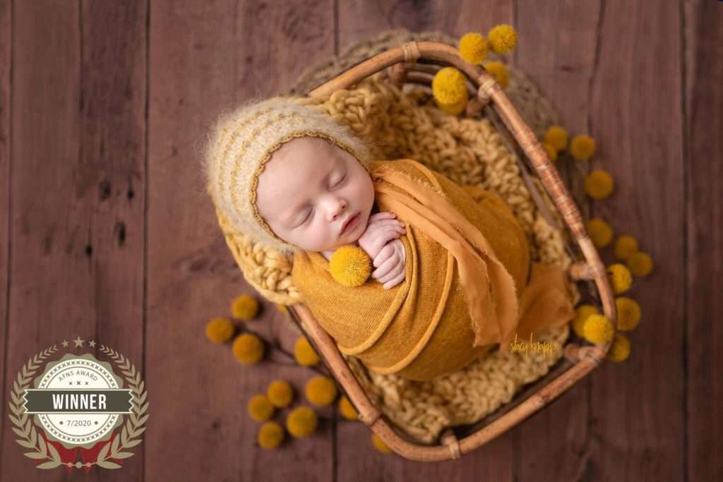 Newborn photography winners - baby girl in yellow