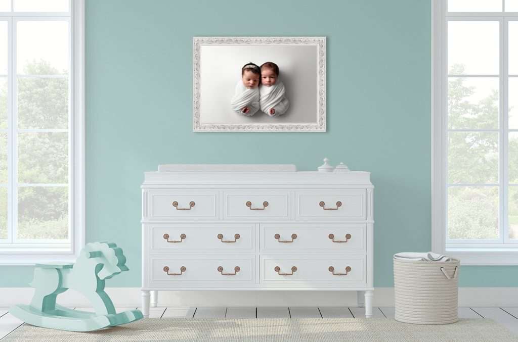 Canvas portrait of newborn baby twins in ornate white frame