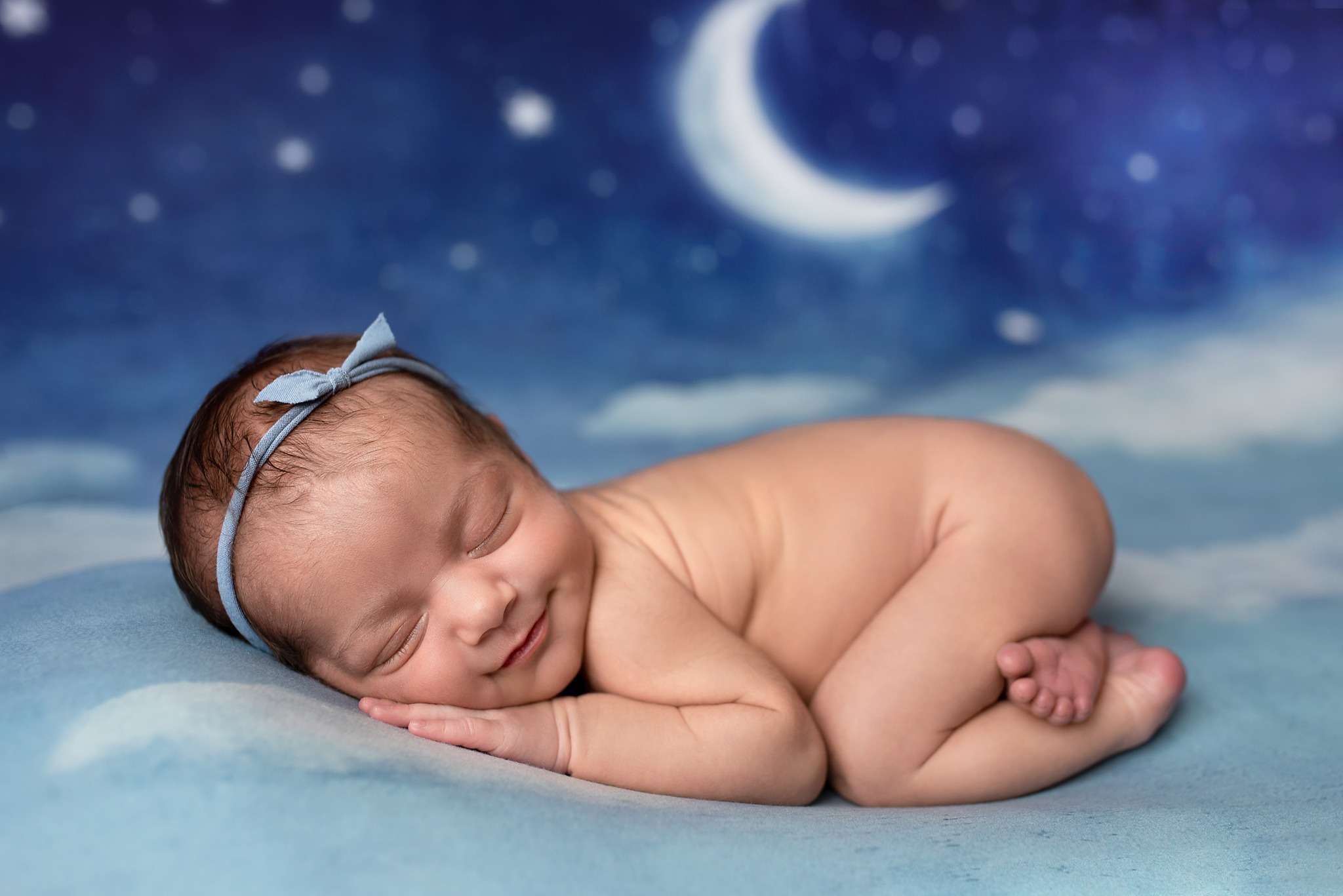 Maine newborn baby girl on moon backdrop by photographer Stacy Knapp Photography