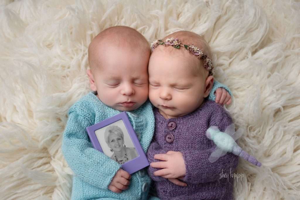 Maine newborn baby girl and boy twins holding photo of grandmother by photographer Stacy Knapp Photography