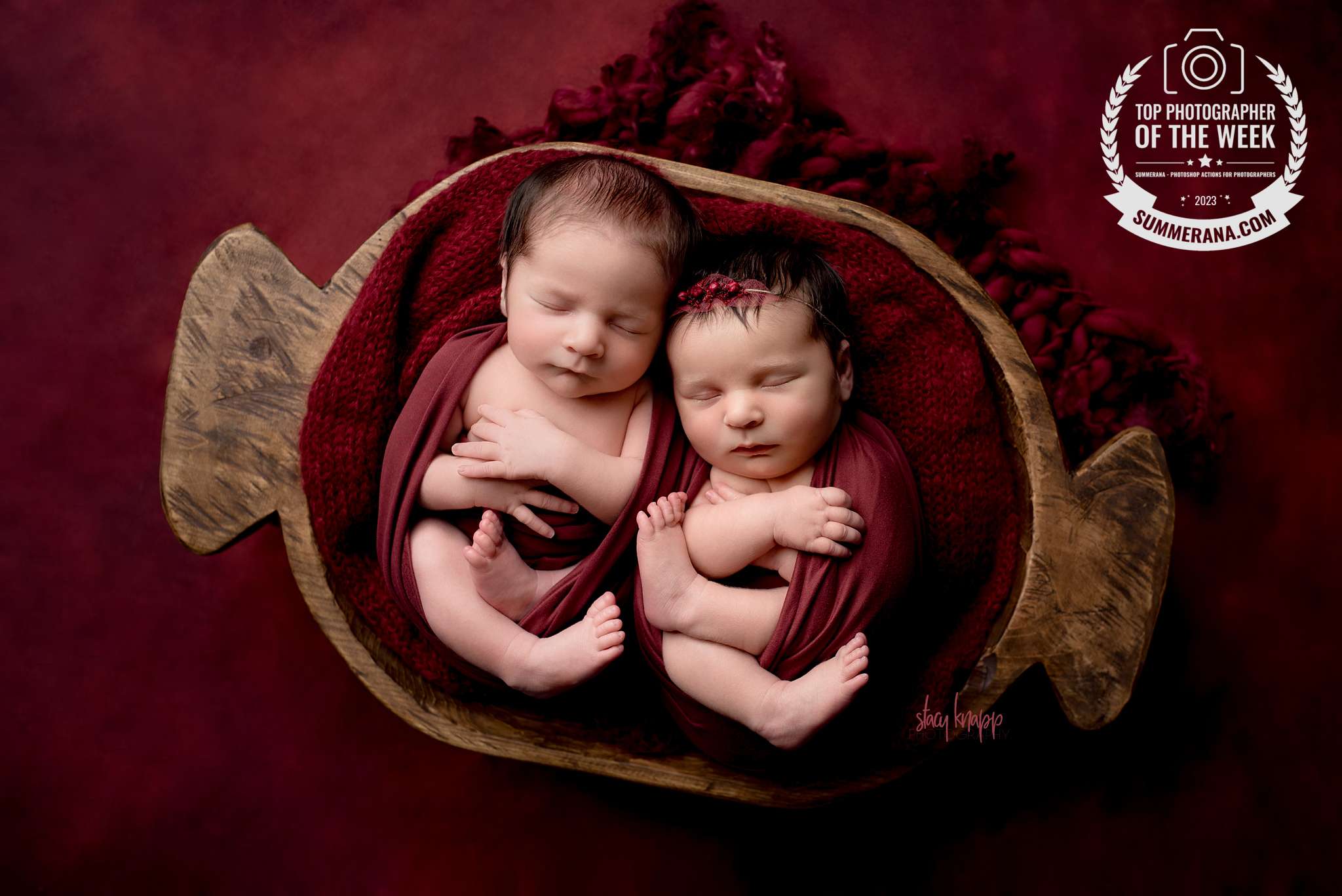 Photo of Maine newborn baby twins wrapped in red by Maine's best newborn photographer Stacy Knapp Photography