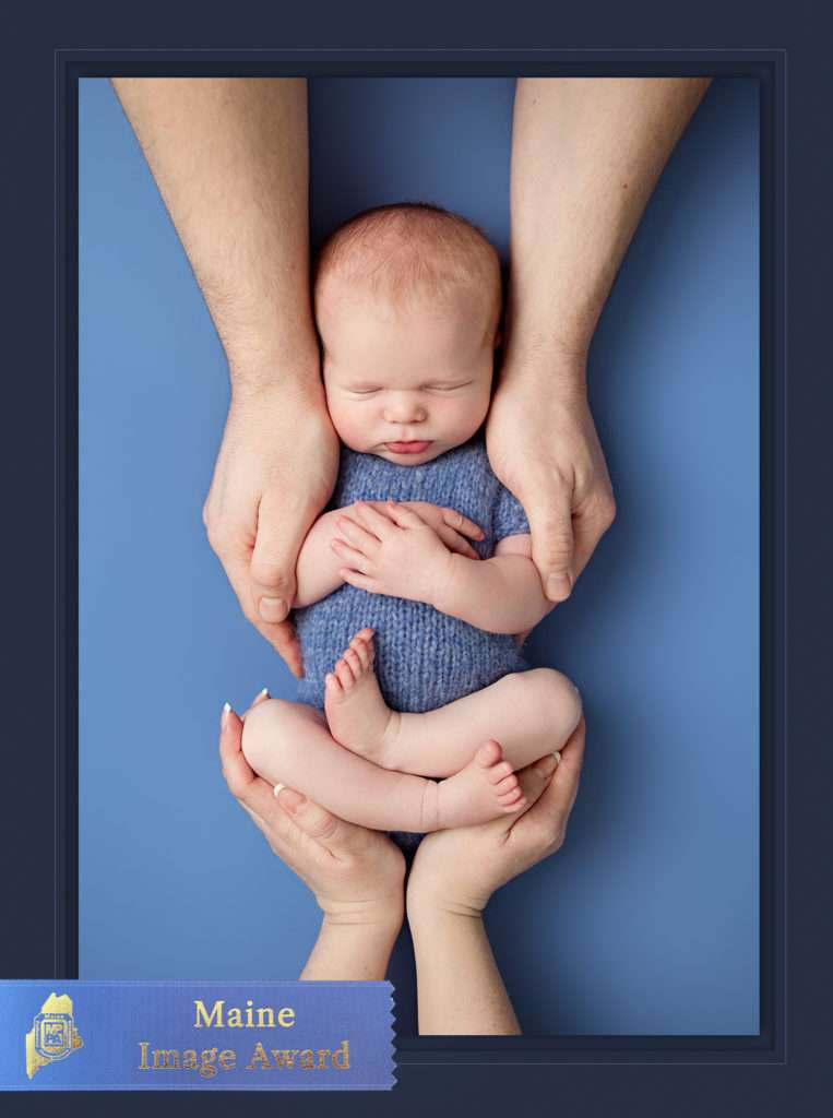 MPPA Maine blue ribbon merit award winning photo of Maine newborn baby boy with his big brother and two moms by Stacy Knapp Photography