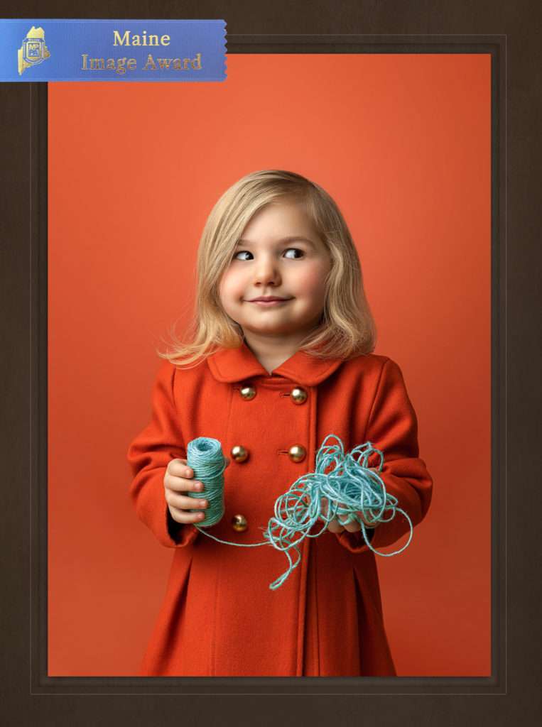 MPPA Maine blue ribbon merit award winning photo of a Maine little girl wearing orange by Stacy Knapp Photography