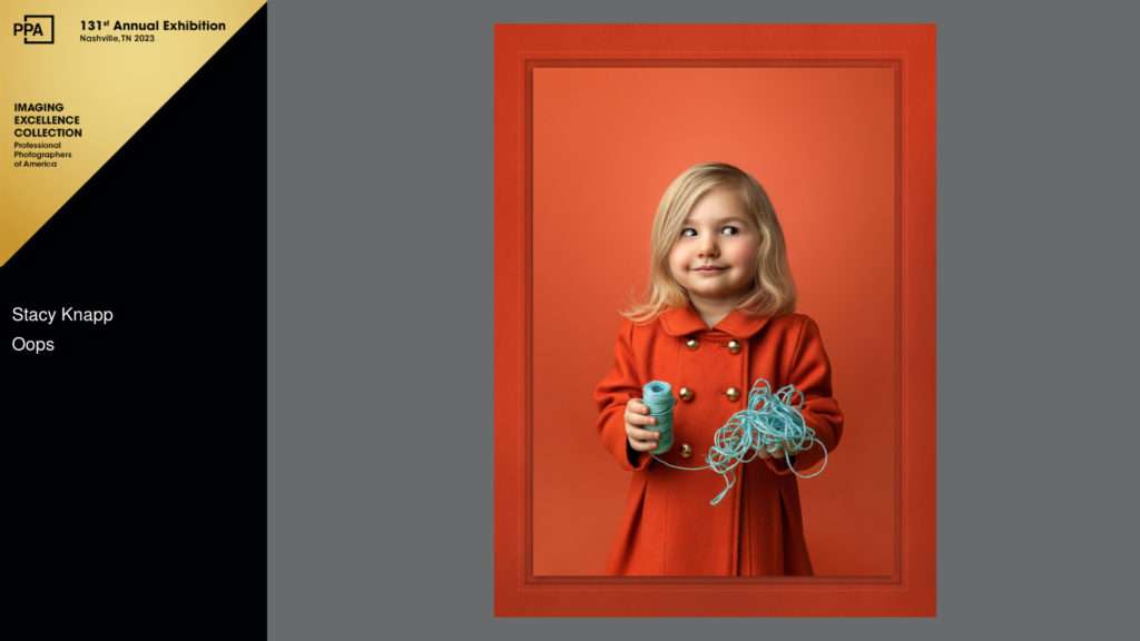 Award winning photo of a little girl weaning an orange coat by photographer Stacy Knapp Photography